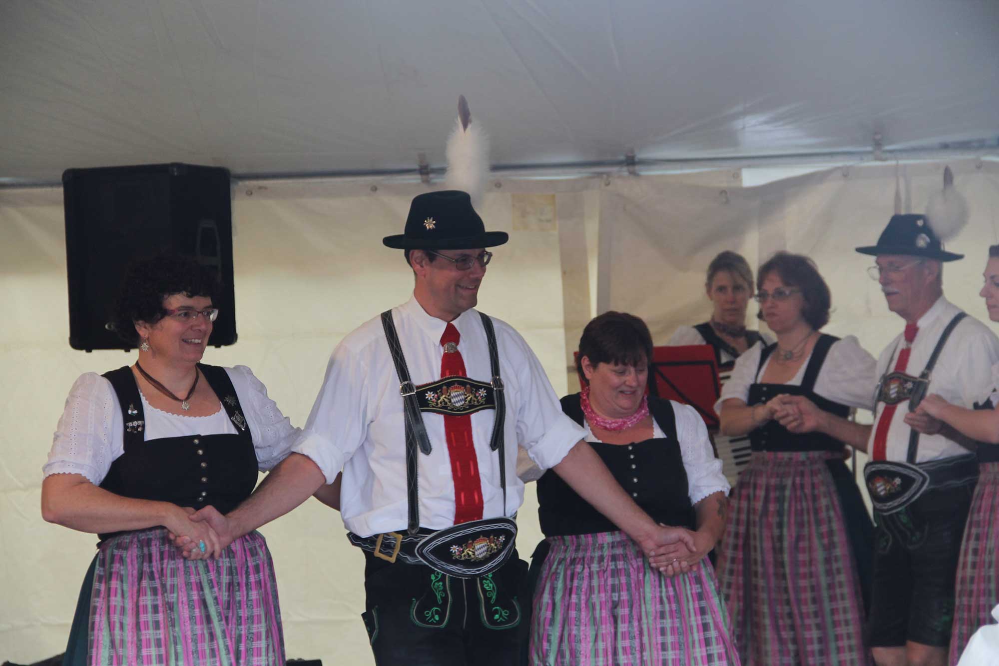 A group of people in traditional bavarian garb.